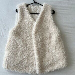white fur vest with pockets